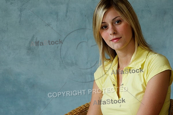 Girl with blonde hair sitting