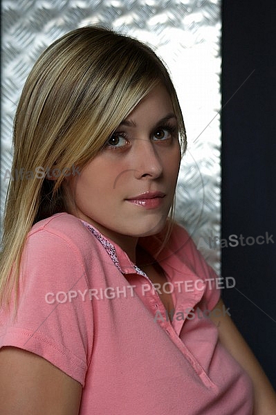 Woman with blonde hair in pink shirt