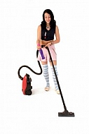 Yung girl with vacuum cleaner. White background